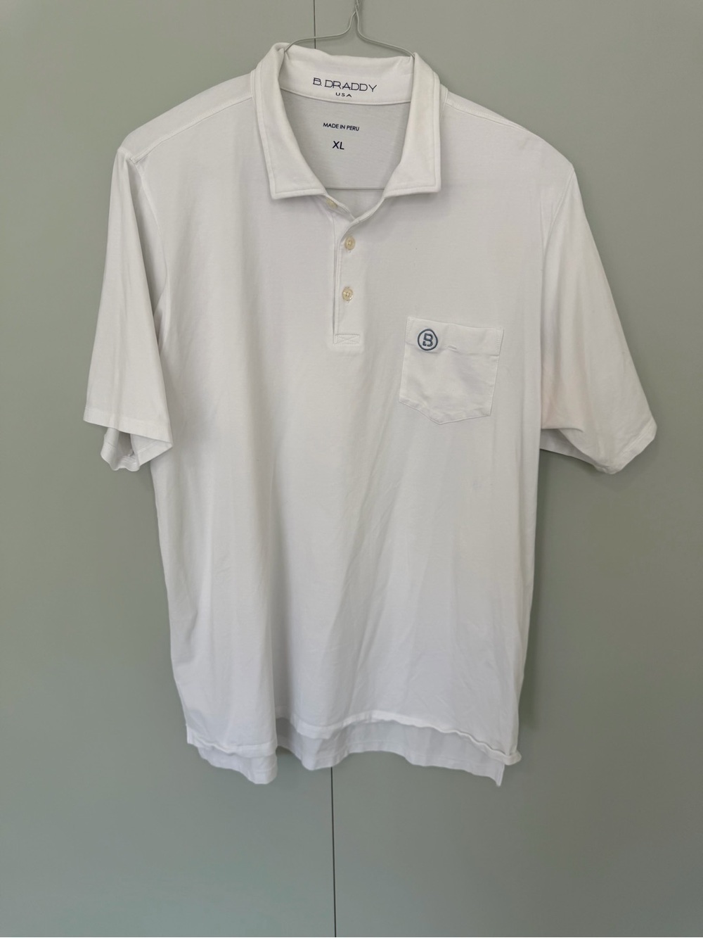 B.DRADDY Men’s Solid White Liam Polo with North Carolina flag and “B” Logo Patch - Picture 1 of 8